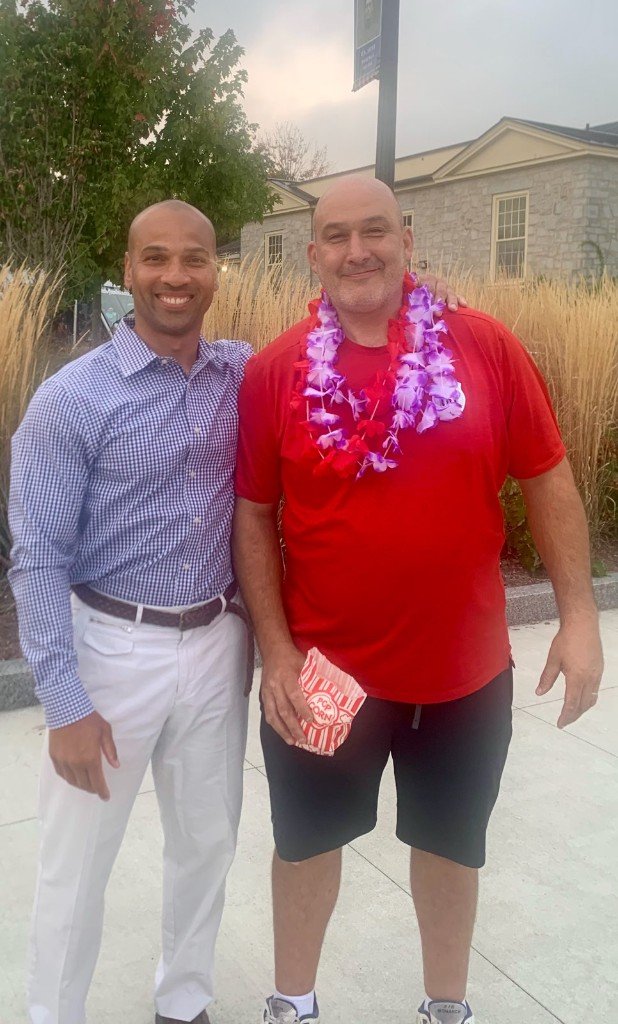 Clinton Graham with a neighbor at a community celebration