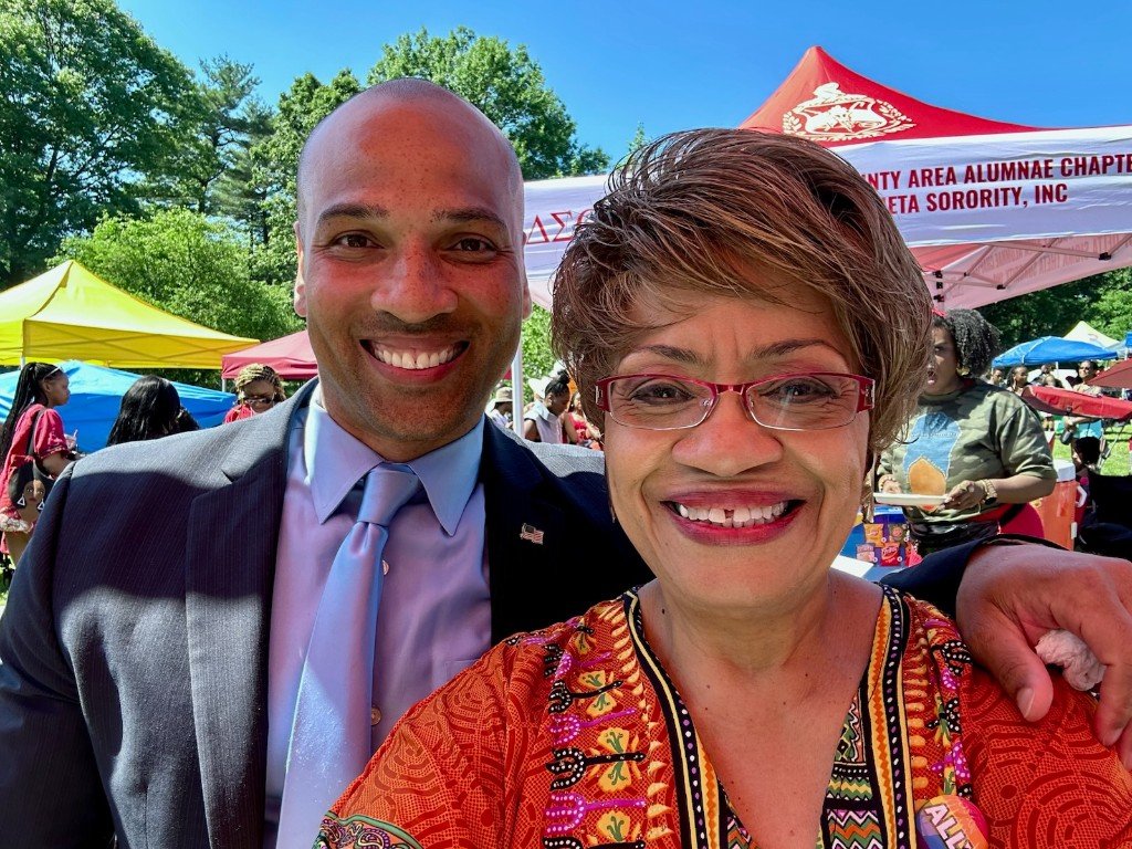 Clinton Graham with a community leader at a Delta Sigma Theta event
