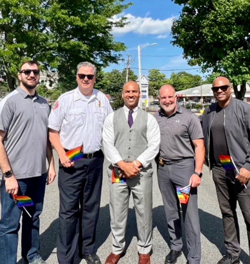 Clinton Graham with community leaders at a Pride celebration