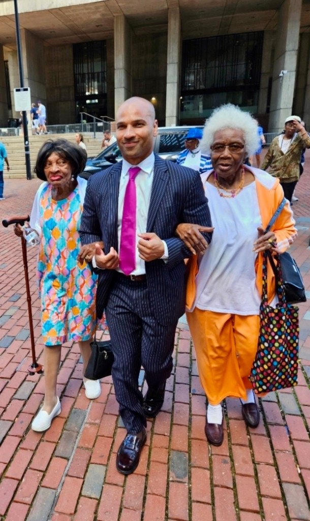 Clinton Graham walking with senior neighbors